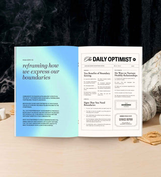 Open journal on a table with a blurred background