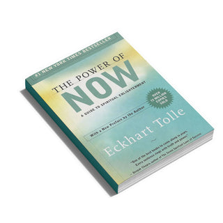 The Power of Now: A Guide to Spiritual Enlightenment paperback book by Eckhart Tolle, shown at an angle on a white background.